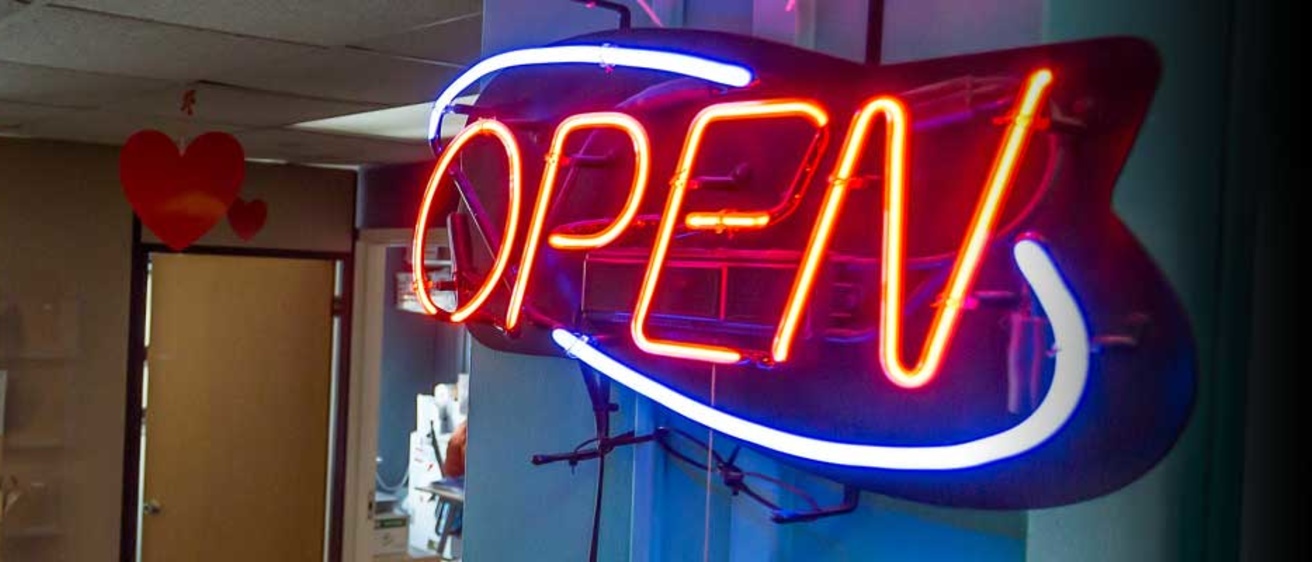 Neon "Open" sign in the SLC IMU offices